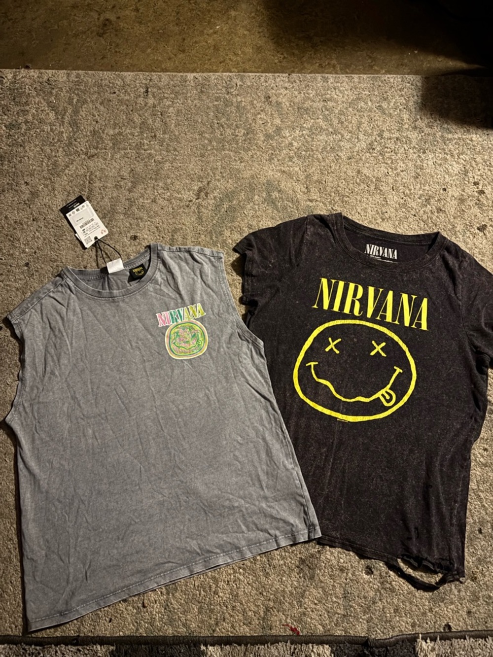 NIRVANA Black Tee & Gray Sleeveless Tank with Yellow Smile Logo. Tour dates list